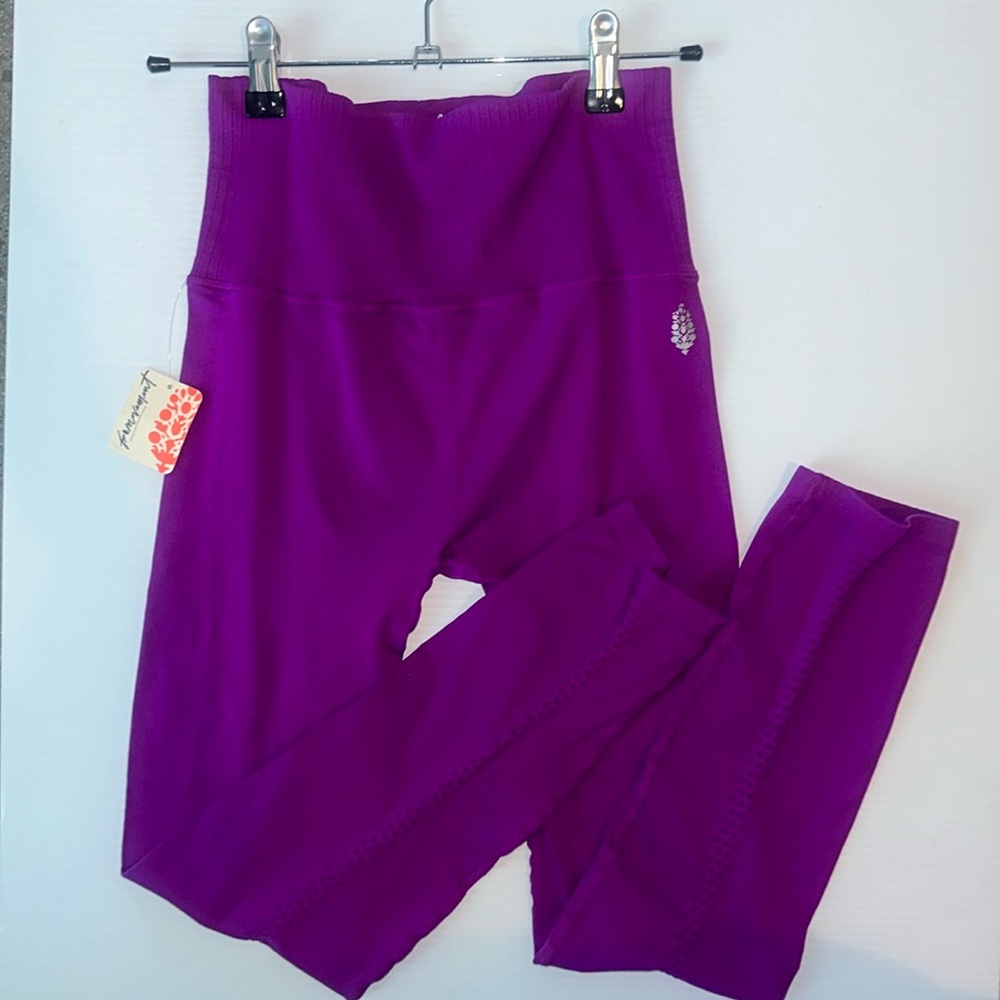 Free people movement brand purple leggings in size M/L.